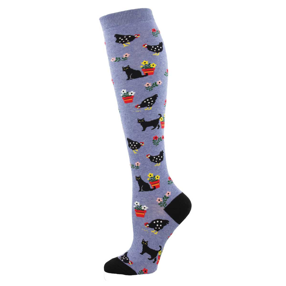 A pair of knee-high socks with a pattern of cats, flowers, and dots on a blue background.