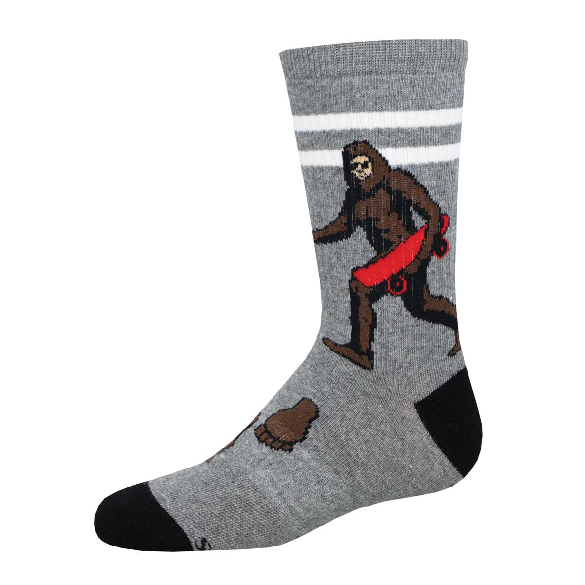 A pair of gray crew socks with a pattern featuring an illustration of Sasquatch skateboarding, designed for youth.