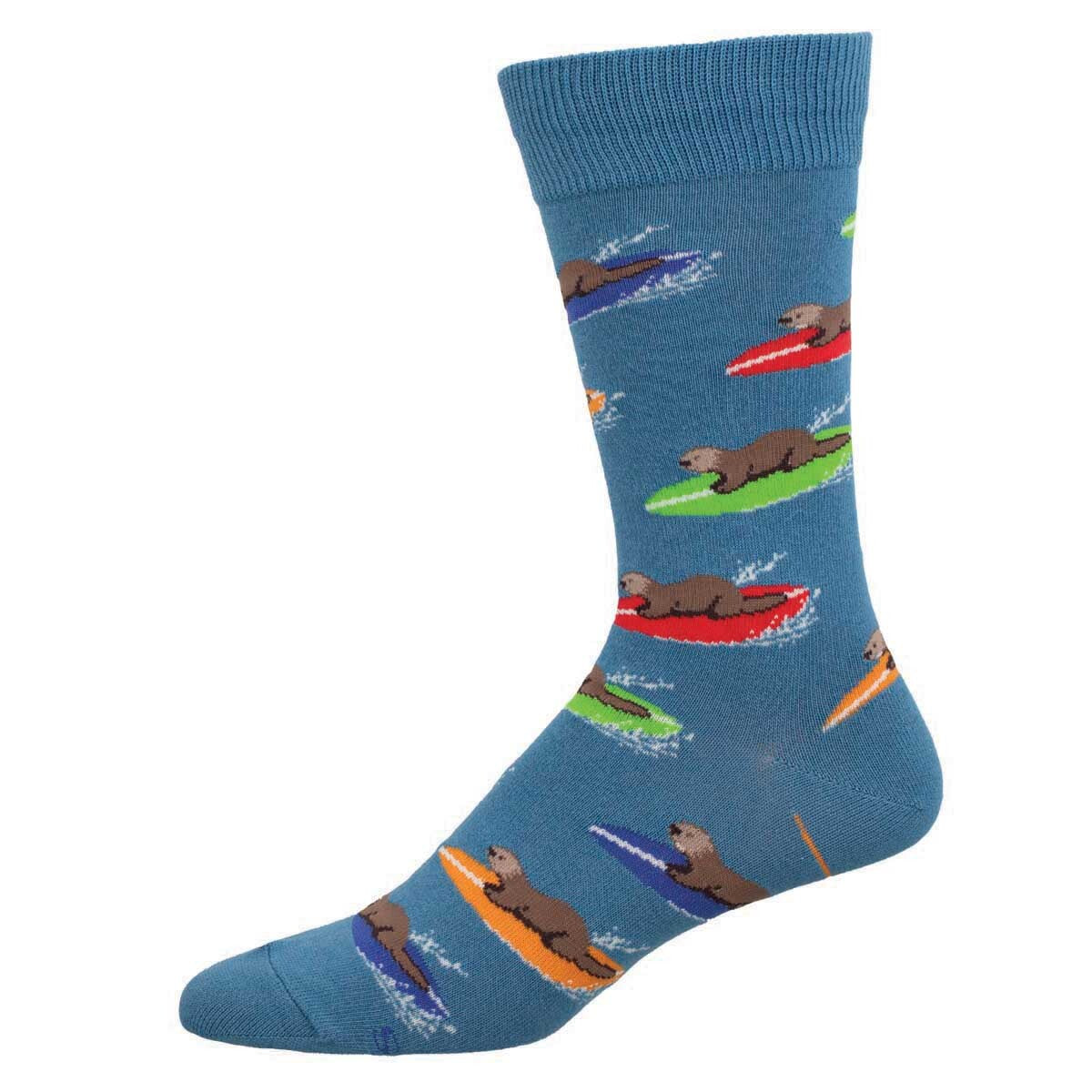 A pair of blue cotton crew socks with a pattern of otters surfing on colorful surfboards.