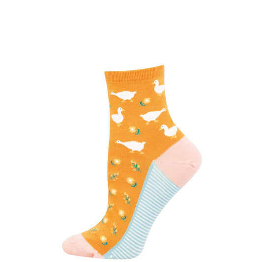 Orange sock with duck pattern on a white background