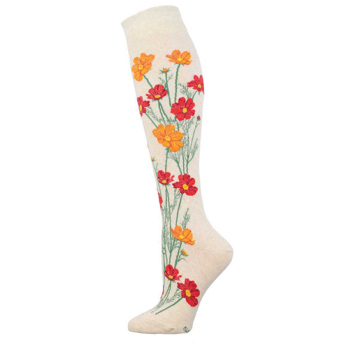 A pair of knee-high socks with a floral pattern featuring red and yellow flowers on a white background.