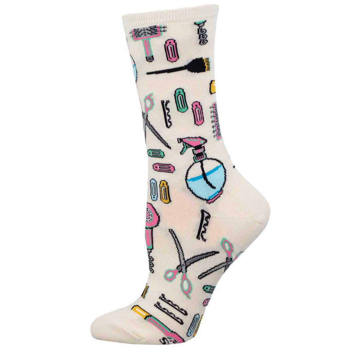 A pair of white crew socks with a pattern of hair salon tools such as scissors, hair clips, and a hair dryer.
