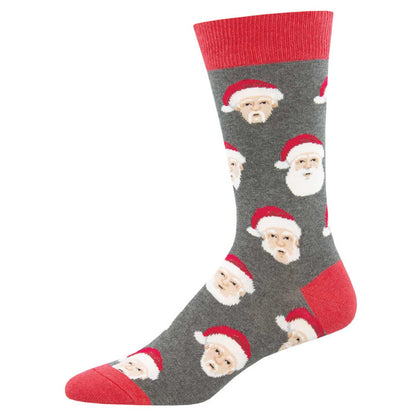 A pair of grey crew socks with a pattern of Santa Claus faces
