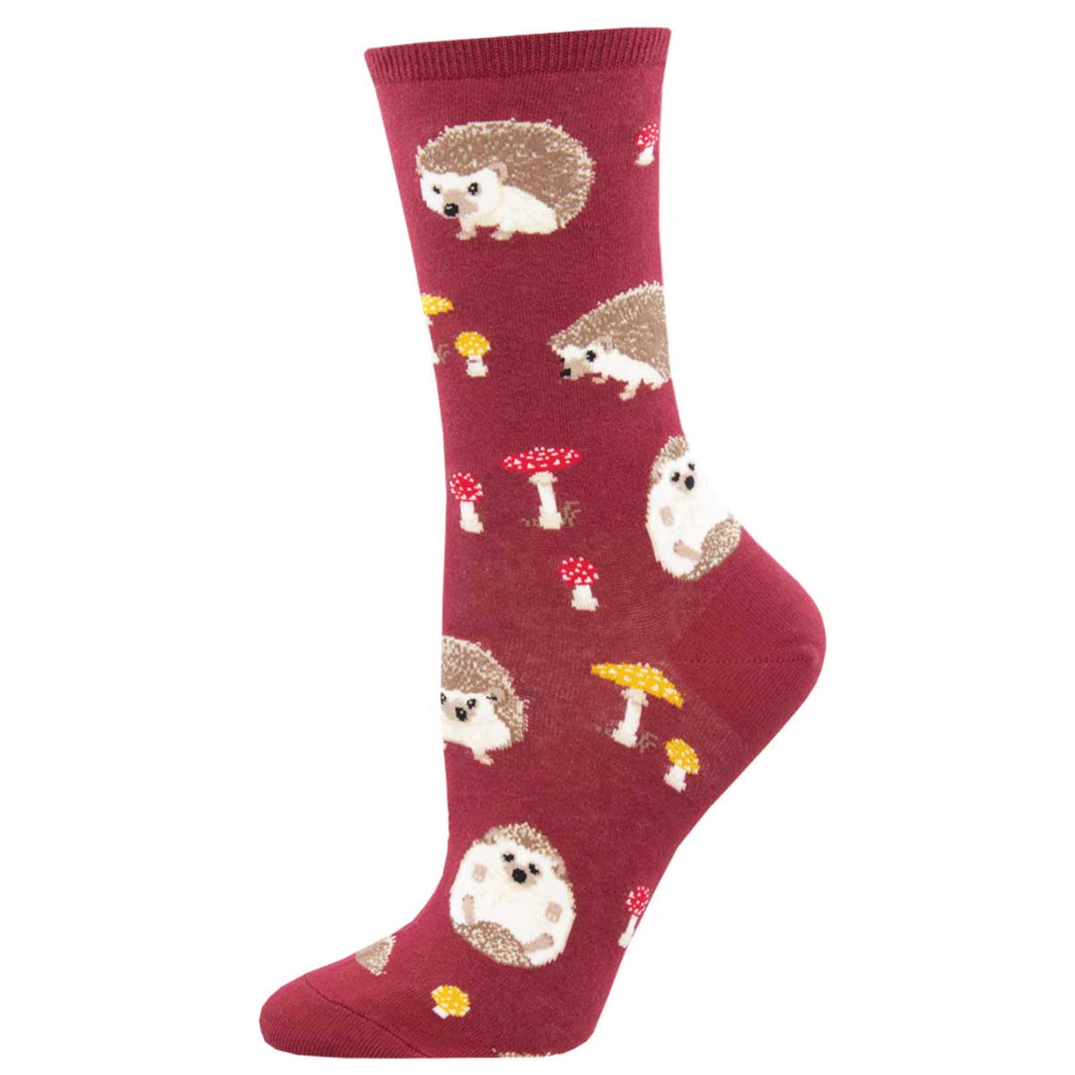 A red crew sock with cartoon hedgehogs, mushrooms, and other forest-themed novelty prints.
