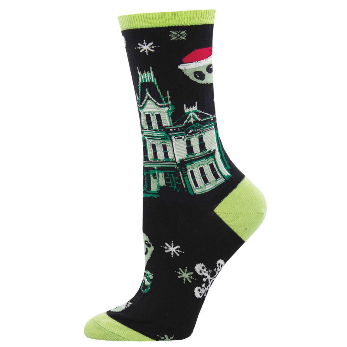 A pair of women's crew socks with a holiday theme, featuring ghostly figures and Christmas decorations on a black background with green accents.