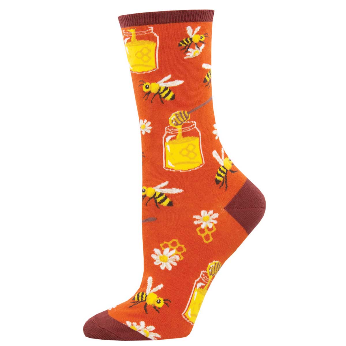 A pair of orange cotton crew socks with a pattern of bees, honey jars, and daisy flowers.