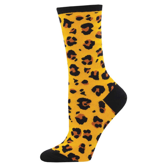 A pair of yellow leopard print cotton crew socks with black heel and toe accents.