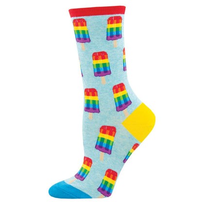 A pair of colorful crew socks with a pattern of ice cream popsicles in a rainbow spectrum design on a light blue background.