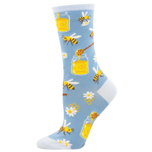 A pair of blue cotton crew socks with a pattern of bees, honey jars, and daisy flowers.