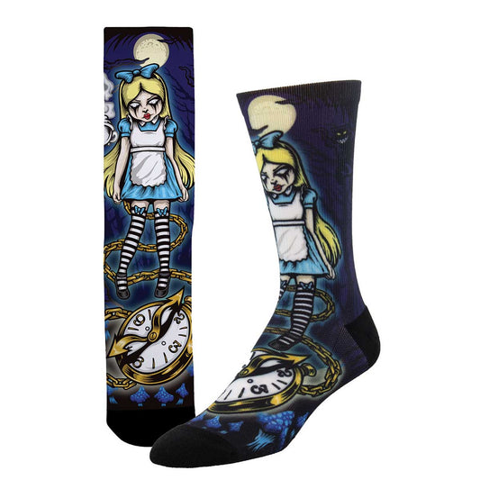 A pair of socks featuring a character illustration of Alice from Alice in Wonderland, with a clock and a Cheshire Cat, set against a dark background.