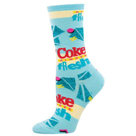 A pair of blue crew socks with Coca-Cola branding and graphic design.