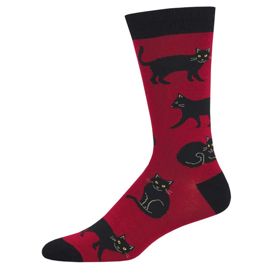 A pair of red crew socks with black cat patterns.