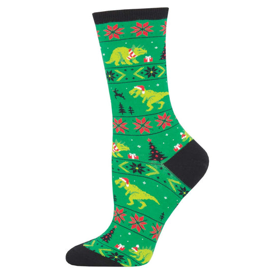 A pair of green crew socks with a pattern of dinosaurs in Santa hats, snowflakes, and Christmas trees.