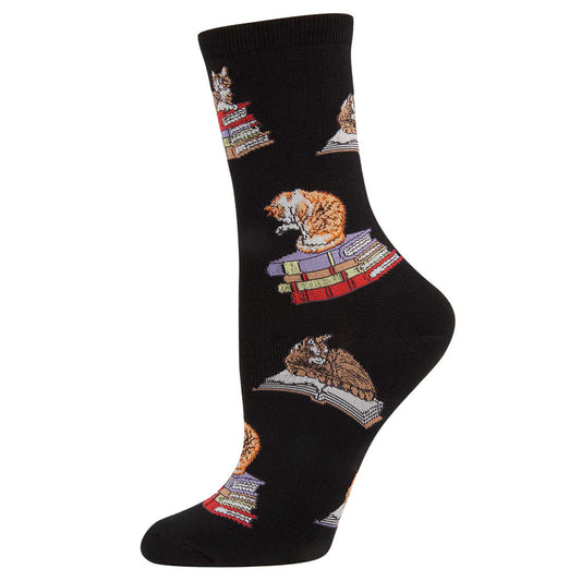 A pair of black crew socks with an pattern of cats sitting on books.