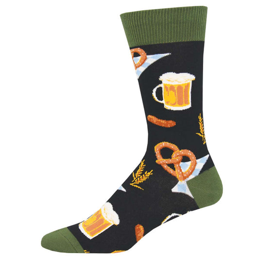 A pair of novelty cotton socks featuring a pattern with pretzels, beer mugs, and sausages on a black background with a green cuff.