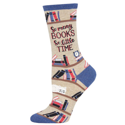 A pair of cotton crew socks with a pattern of books and the phrase 'So many BOOKS So little TIME' printed on them, predominantly beige with blue accents.