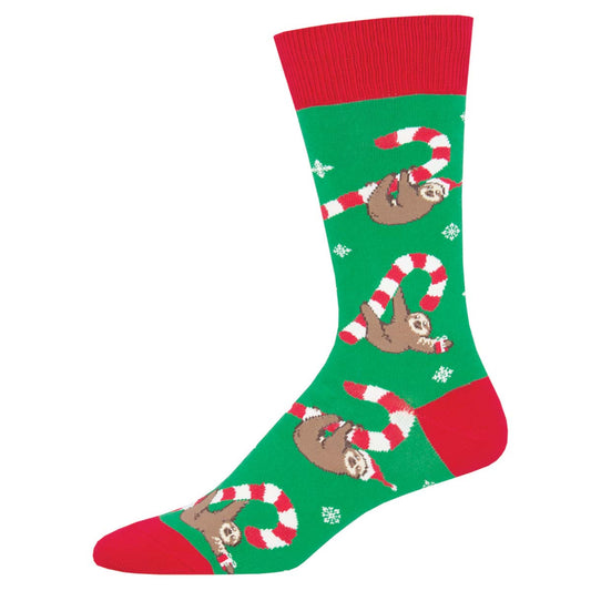A pair of Christmas-themed crew socks featuring sloth animals holding candy canes, with a green background and red at the toe and heel.