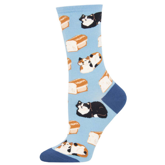 A pair of blue cotton crew socks featuring a 'cat loaf' bread pattern with black and white cats on a light blue background.