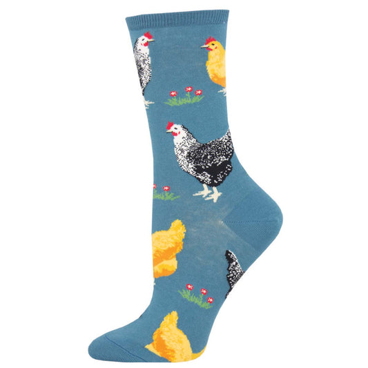 A pair of blue crew socks with a pattern of chickens and flowers.