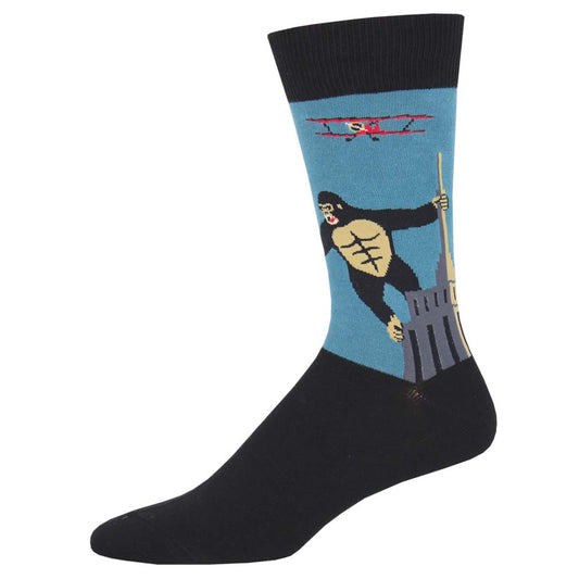 A pair of black crew socks with a design featuring a famous ape standing atop a building