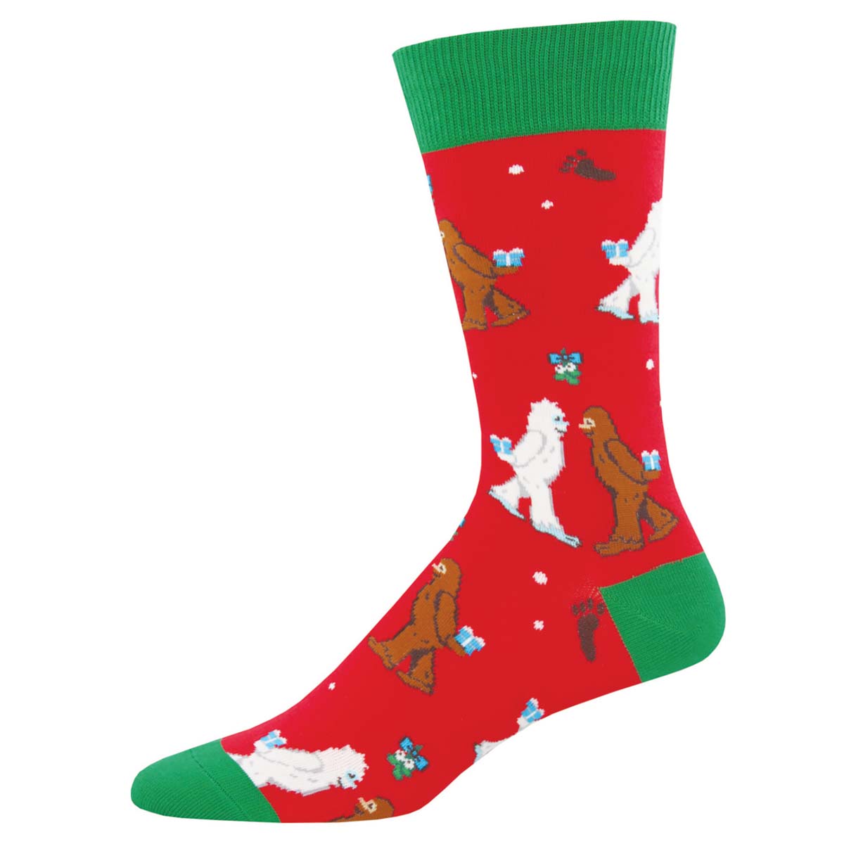 A pair of red crew socks with a Christmas theme, featuring white yetis, green trees, and various holiday-related items like gifts and snowflakes.