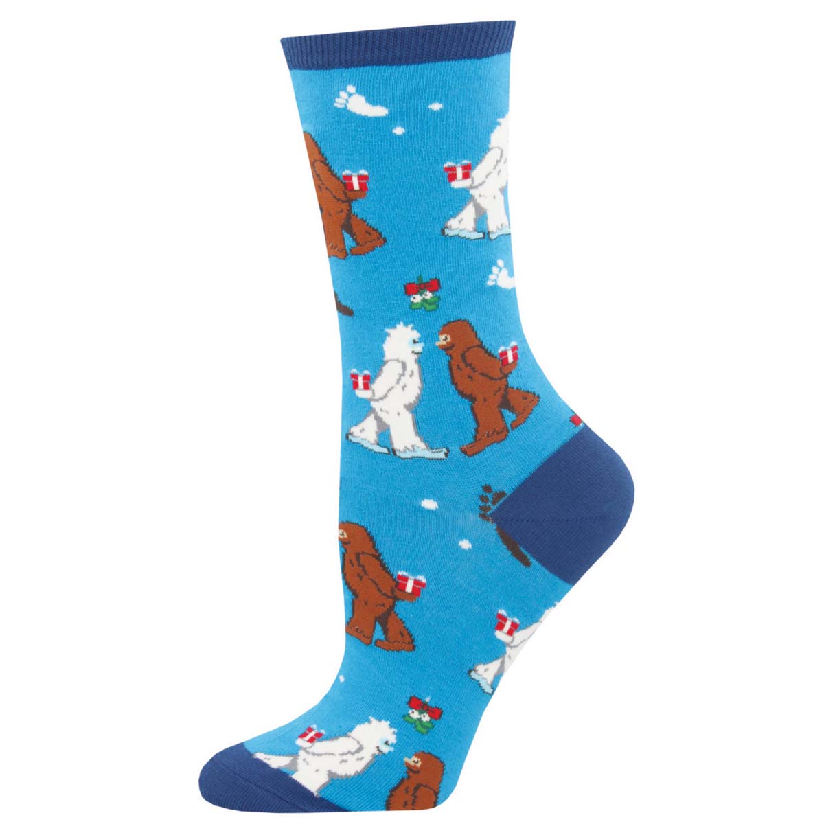 A pair of blue crew socks with a pattern of yetis and bigfoots holding Christmas presents under the mistletoe.