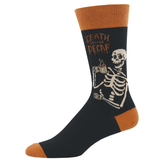 A pair of black crew socks with a skeleton design holding a coffee cup and the text 'DEATH BEFORE DECAF'.
