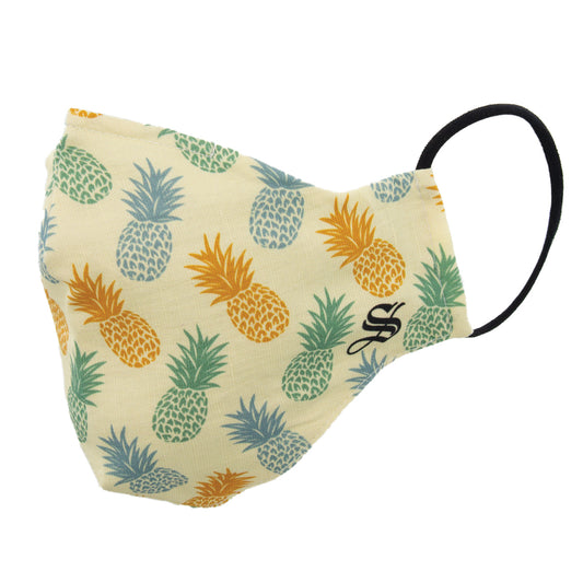 A face mask with a pattern of colorful pineapples, featuring an adjustable ear loop and a nose wire for a snug fit.