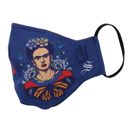 A blue fabric face mask with a printed design of Frida Kahlo surrounded by flowers and butterflies, featuring adjustable black straps.