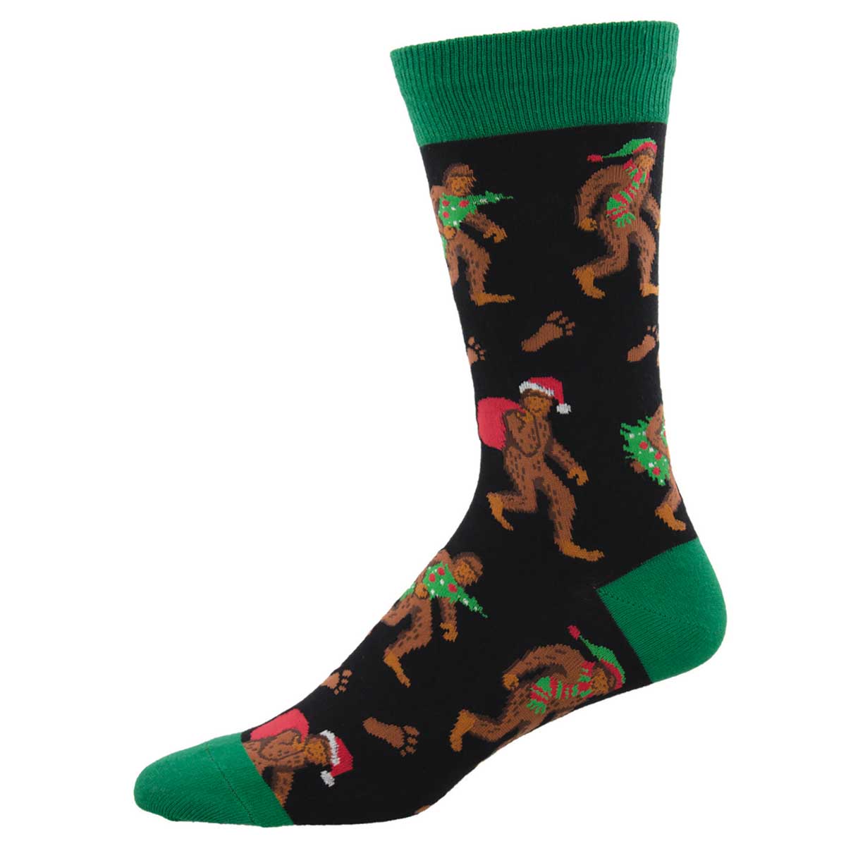 A pair of men's crew socks with a Christmas theme, featuring Bigfoot characters in various festive poses against a black background with green cuffs.