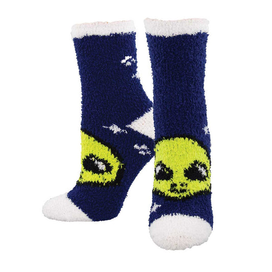 A pair of fuzzy, navy blue socks with a pattern of green alien faces.