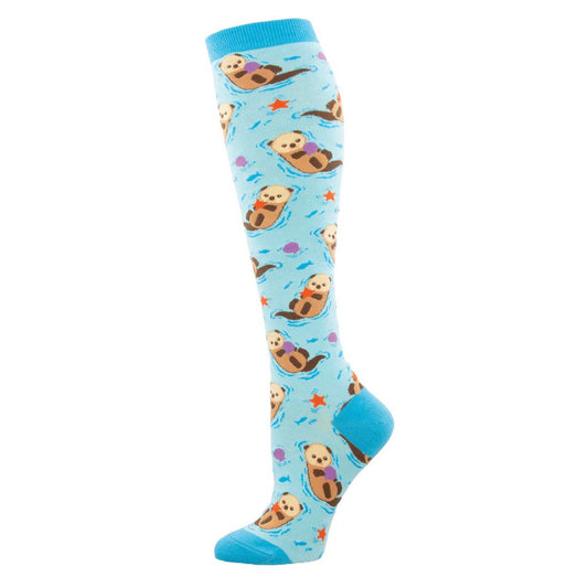 A pair of knee-high socks with a blue background featuring multiple otter designs swimming in an aquatic setting.