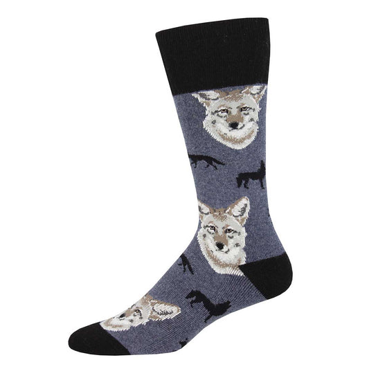 A pair of socks with a pattern that includes a coyote face and silhouette of a boot on a grey background.