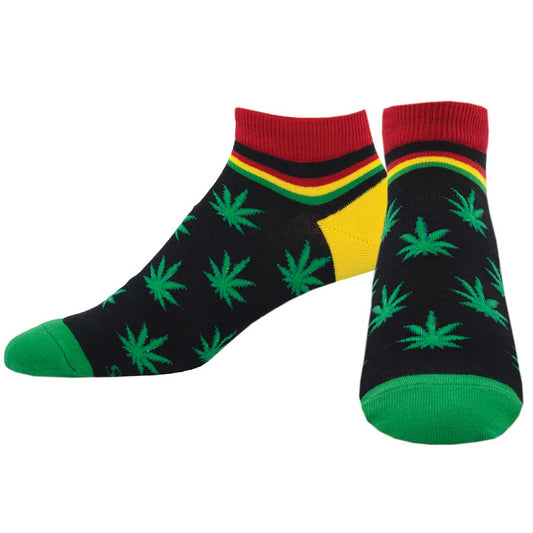 A pair of colorful socks featuring green cannabis leaves with a black background, red and yellow stripes at the top, and green tips on the toes.