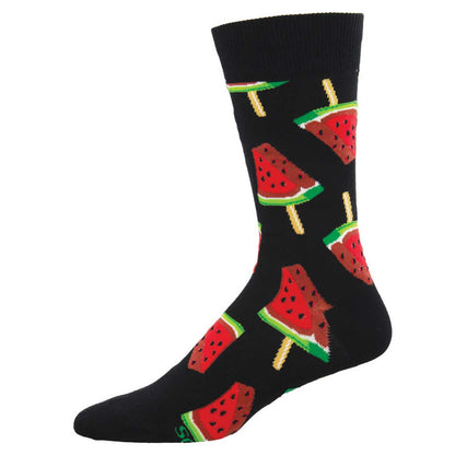 A pair of black socks with a pattern of watermelon slices and popsicles.