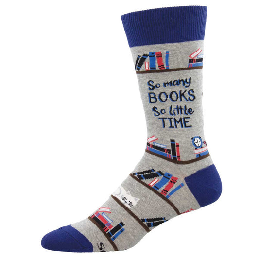 A pair of gray crew socks with a pattern of books and the phrase 'So many BOOKS So little TIME' printed on them, along with blue cuffs.