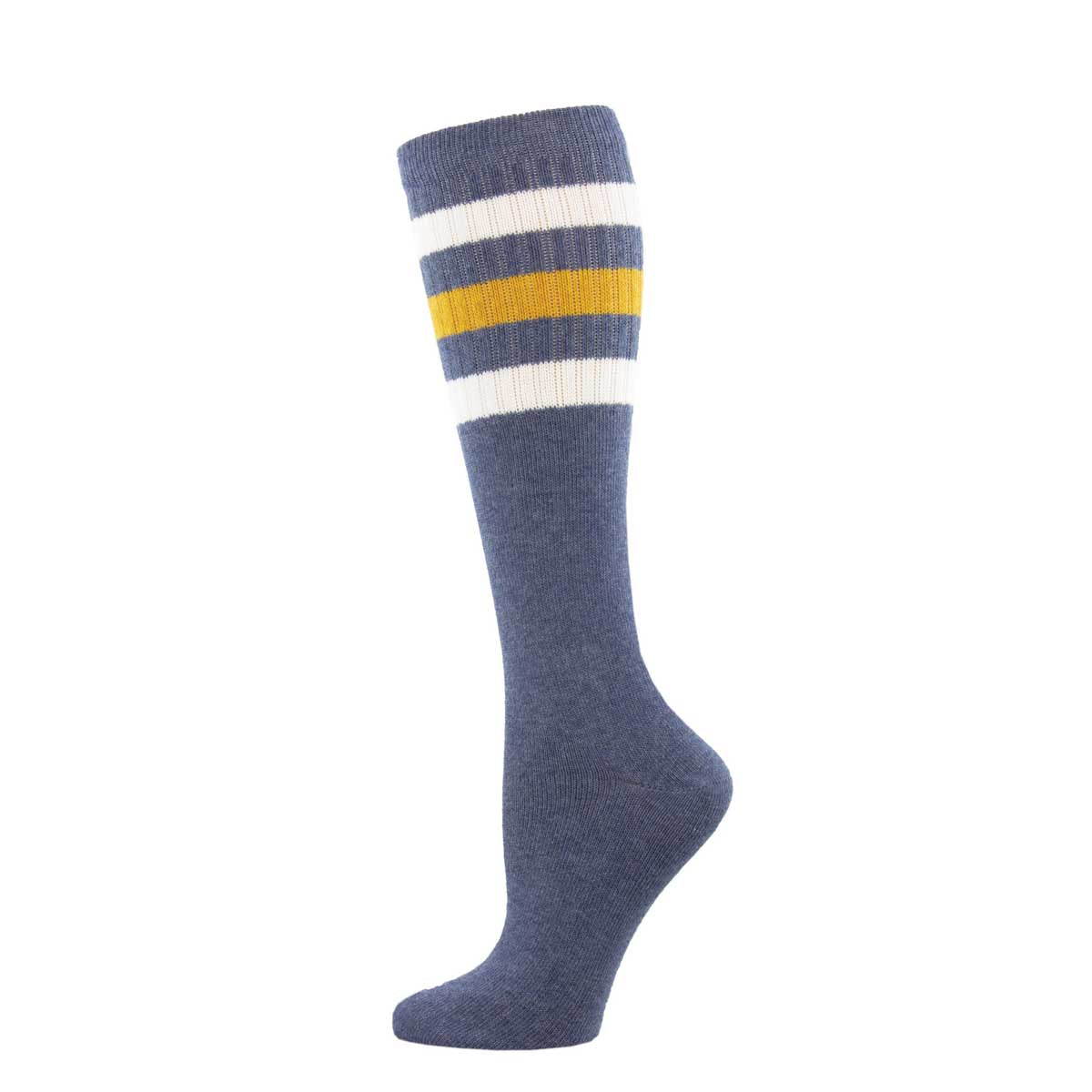A pair of knee-high socks with a striped pattern of against a denim blue background.