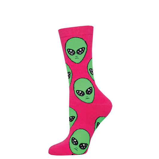 A pair of pink crew socks with green alien heads pattern.