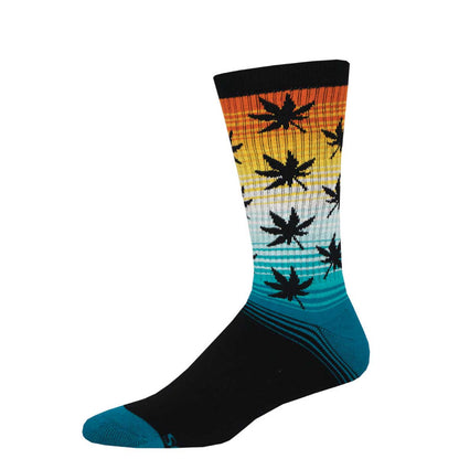 A pair of colorful athletic socks with a geometric pattern featuring cannabis leaves, transitioning from orange to blue colors.