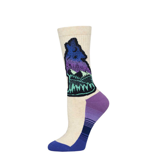 A pair of crew socks with a mountain and wolf design in purple, blue, and green on a beige background.