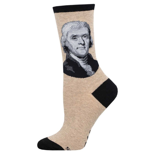 A pair of socks featuring a portrait of Thomas Jefferson on a beige background with black trim.