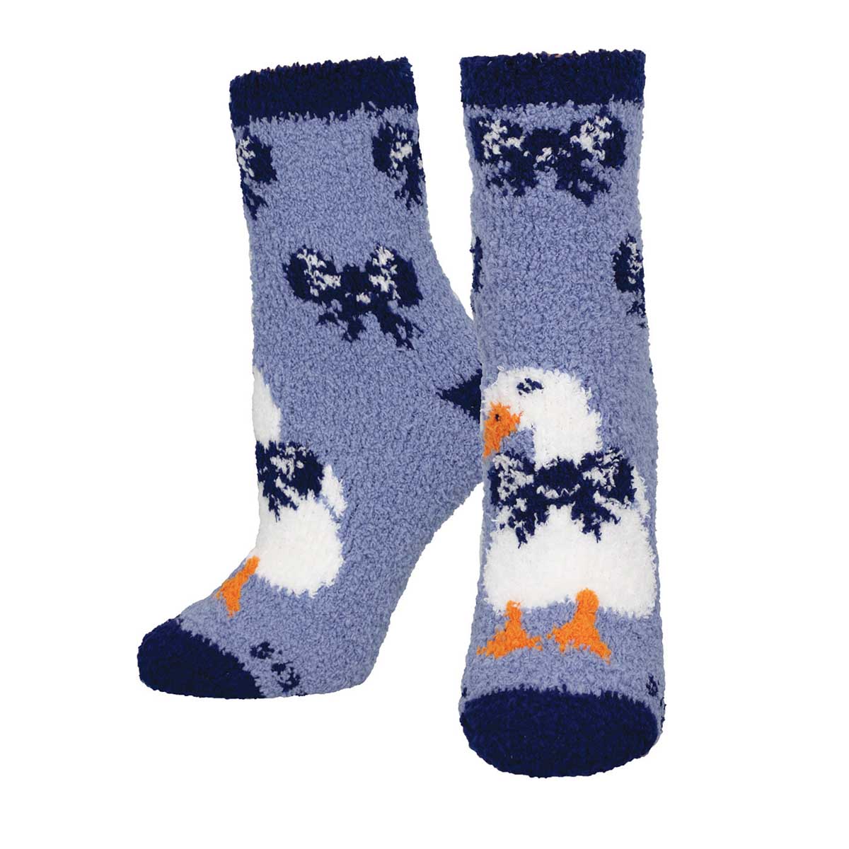 A pair of fuzzy socks with a pattern of ducks and bows on a blue background.