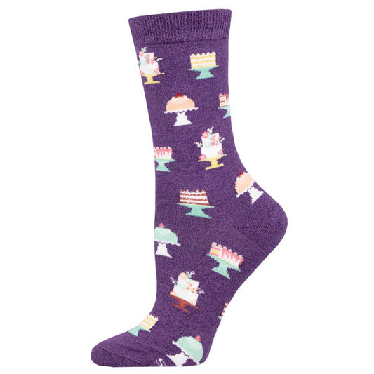A purple sock with a pattern of various desserts like cakes and ice cream.