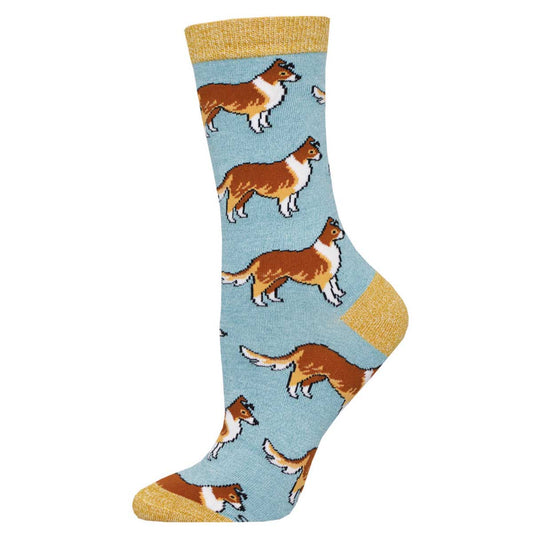 A pair of dog socks with a pattern of Collie dogs in brown, white, and black colors on a light blue background with a yellow heel and toe.