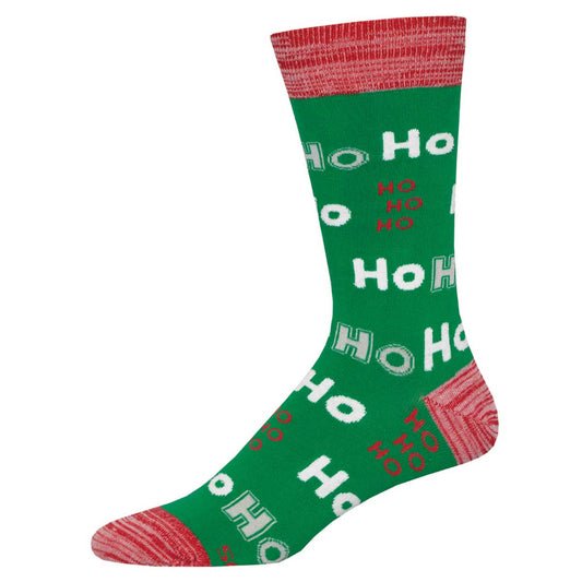 A green crew sock that has a candy red heel, toe, and cuff with the text 'Ho Ho Ho' repeated across the surface.