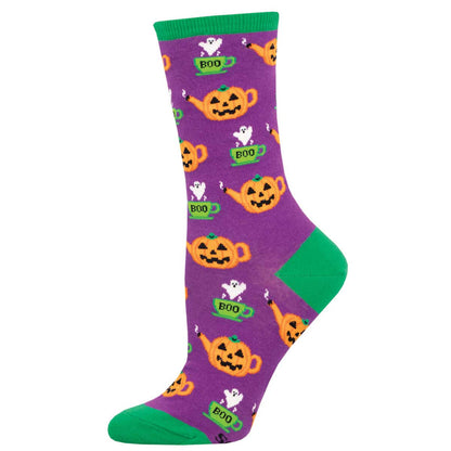 A pair of purple socks with green trim featuring orange pumpkin designs and the word 'BOO' on them.