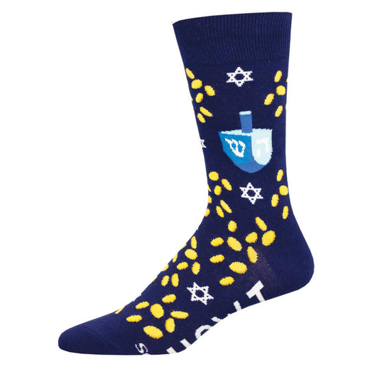 A pair of navy blue cotton crew socks with a pattern of yellow coins, stars, and a blue dreidel on the ankle area.