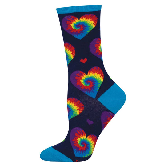 A pair of colorful tie-dye socks with heart patterns on a dark background with blue trim at the top.