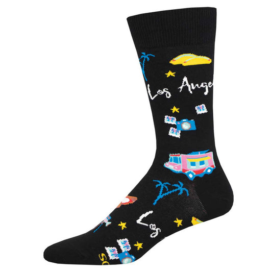 A pair of black crew socks with Los Angeles text and various city-themed illustrations such as palm trees, stars, and a food truck.