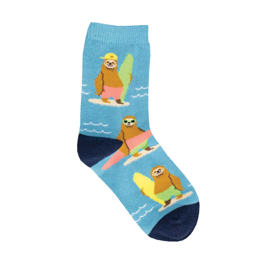 A pair of kids' socks with a blue background featuring a sloth riding a surfboard design.